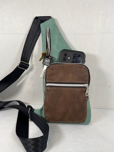 wanderlust sling brown pocket green strap