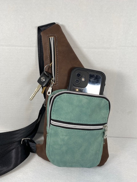 wanderlust sling green pocket brown strap